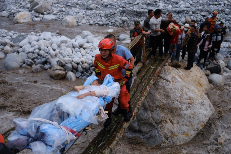 Rescuers look for survivors after dozens killed in China quake