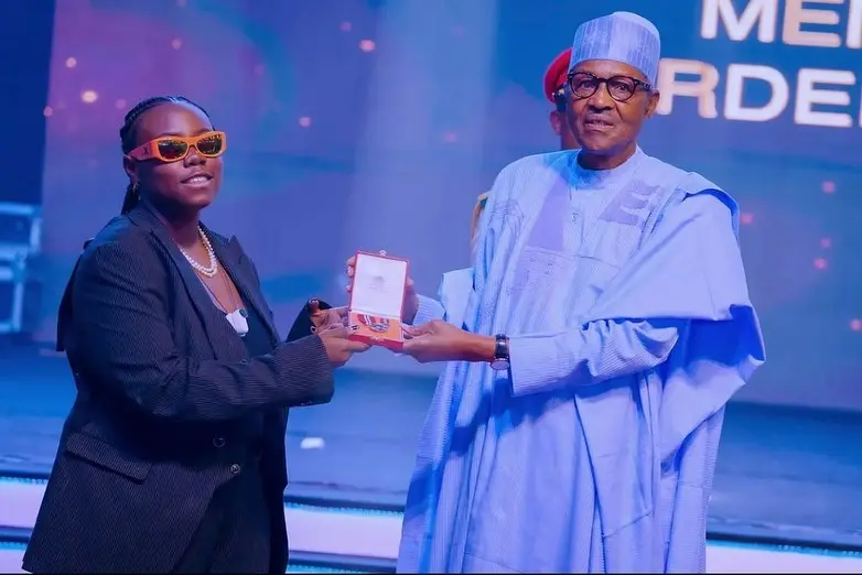 Buhari confers national honours on Burna Boy, 2Face, Teni