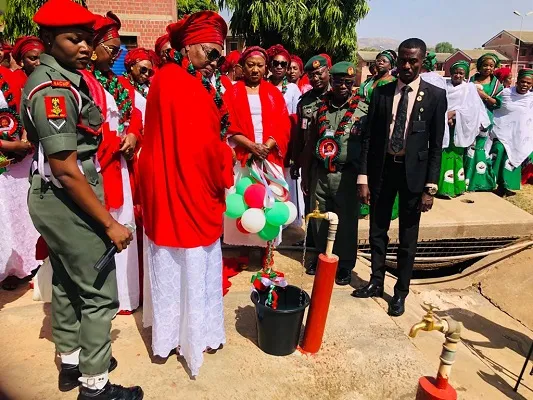 NAOWA commissions borehole, unveils bus for barracks community